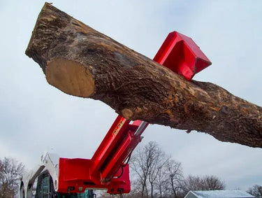 A Pro Series Wood Splitter attachment in action at a logging site.